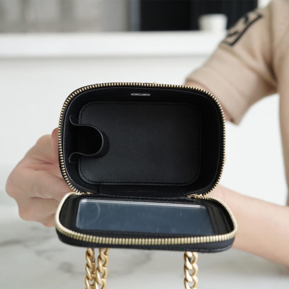 Chanel small gold ball makeup bag
