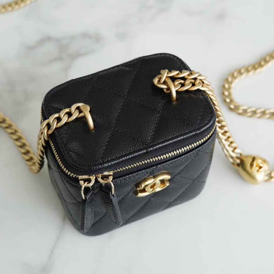 Chanel small gold ball makeup bag