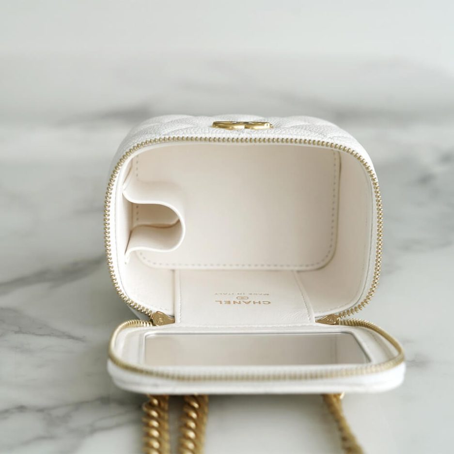 Chanel small gold ball makeup bag