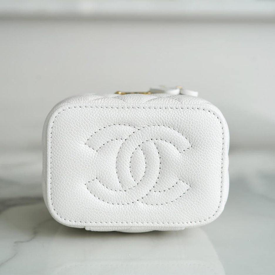 Chanel small gold ball makeup bag