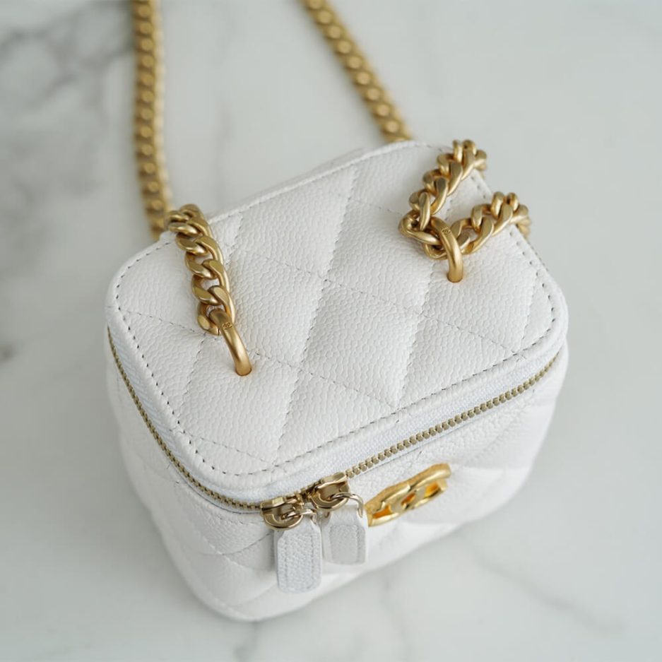Chanel small gold ball makeup bag