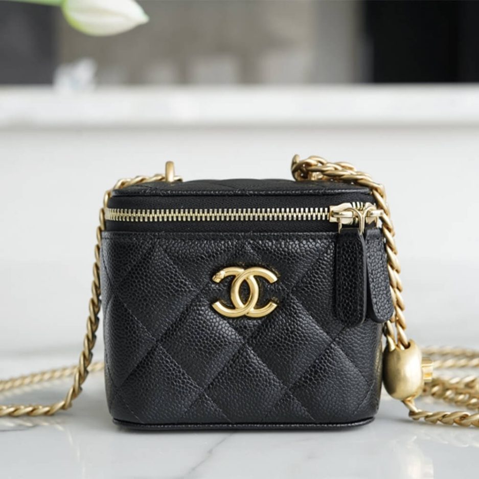 Chanel small gold ball makeup bag