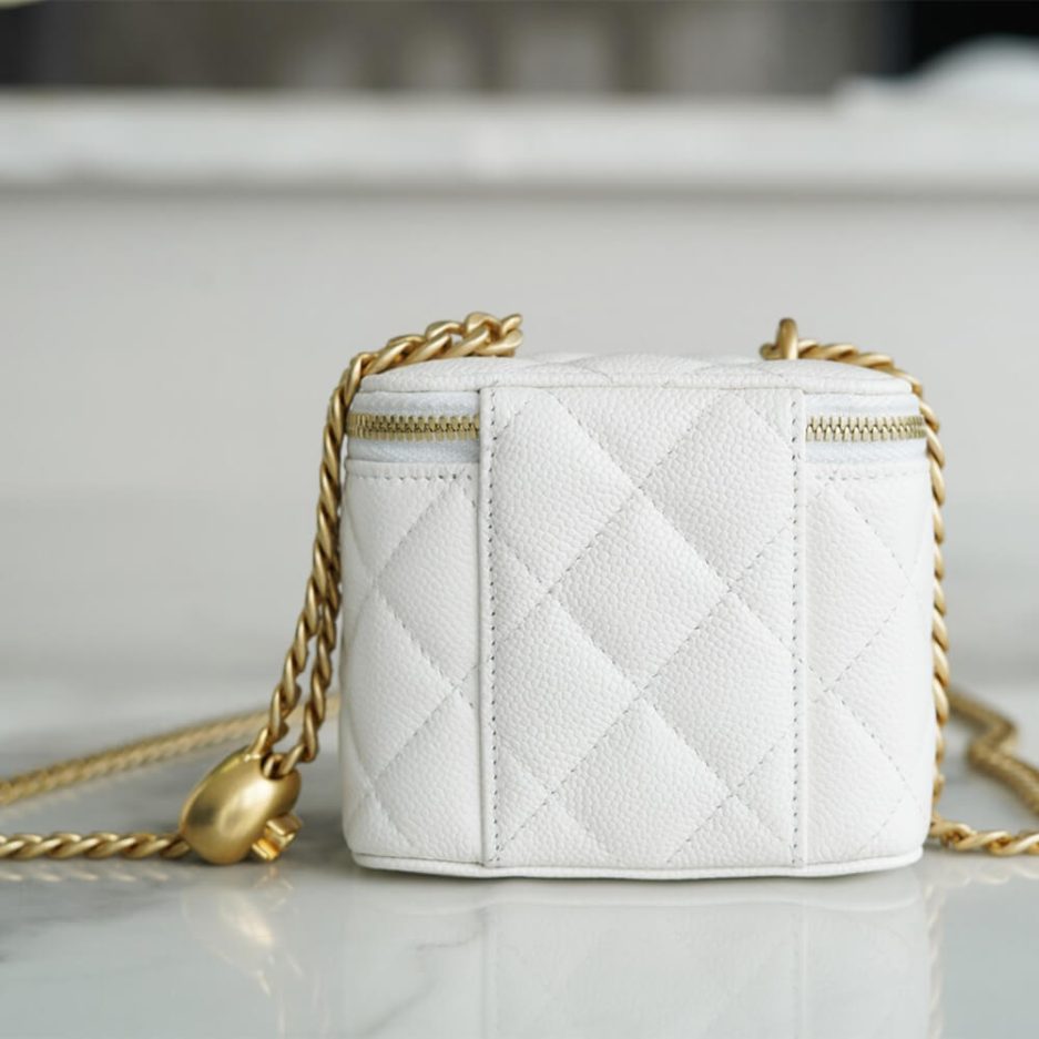 Chanel small gold ball makeup bag