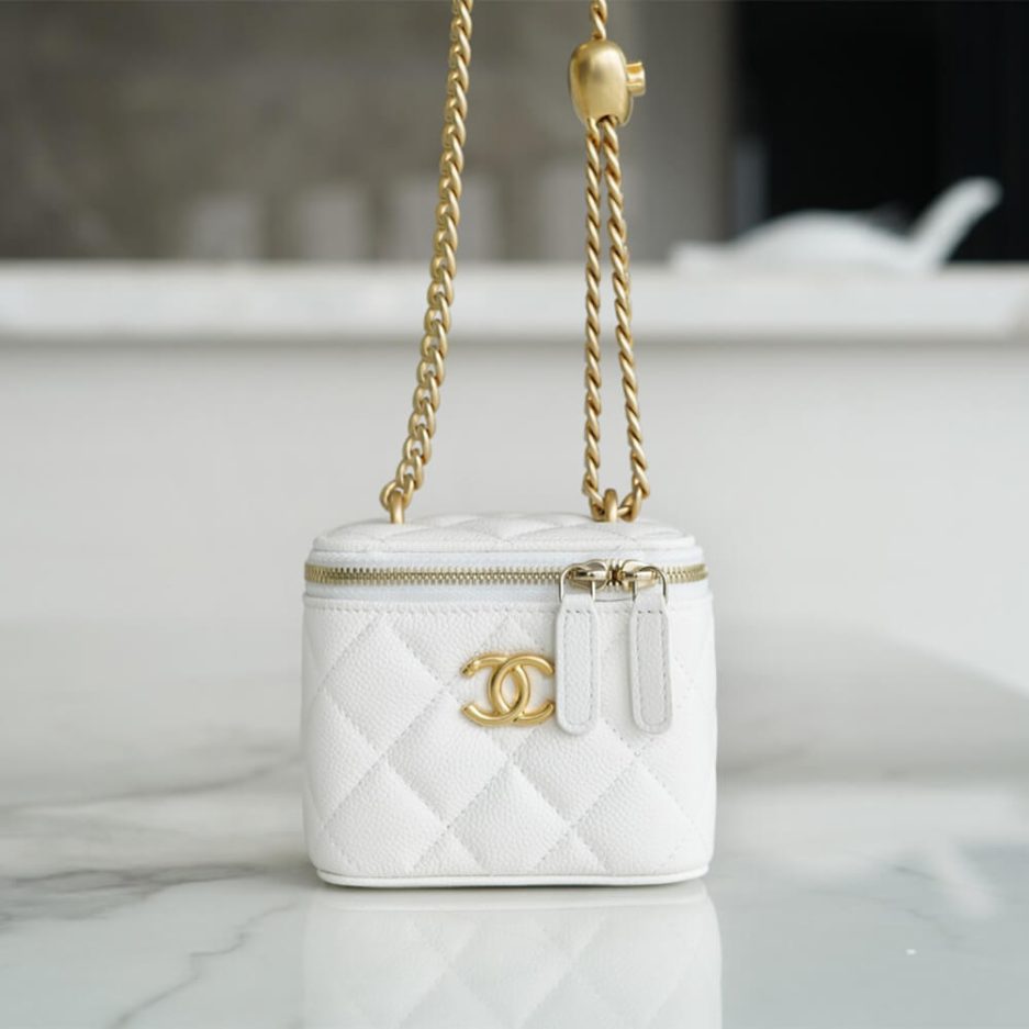 Chanel small gold ball makeup bag
