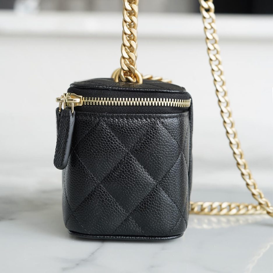 Chanel small gold ball makeup bag