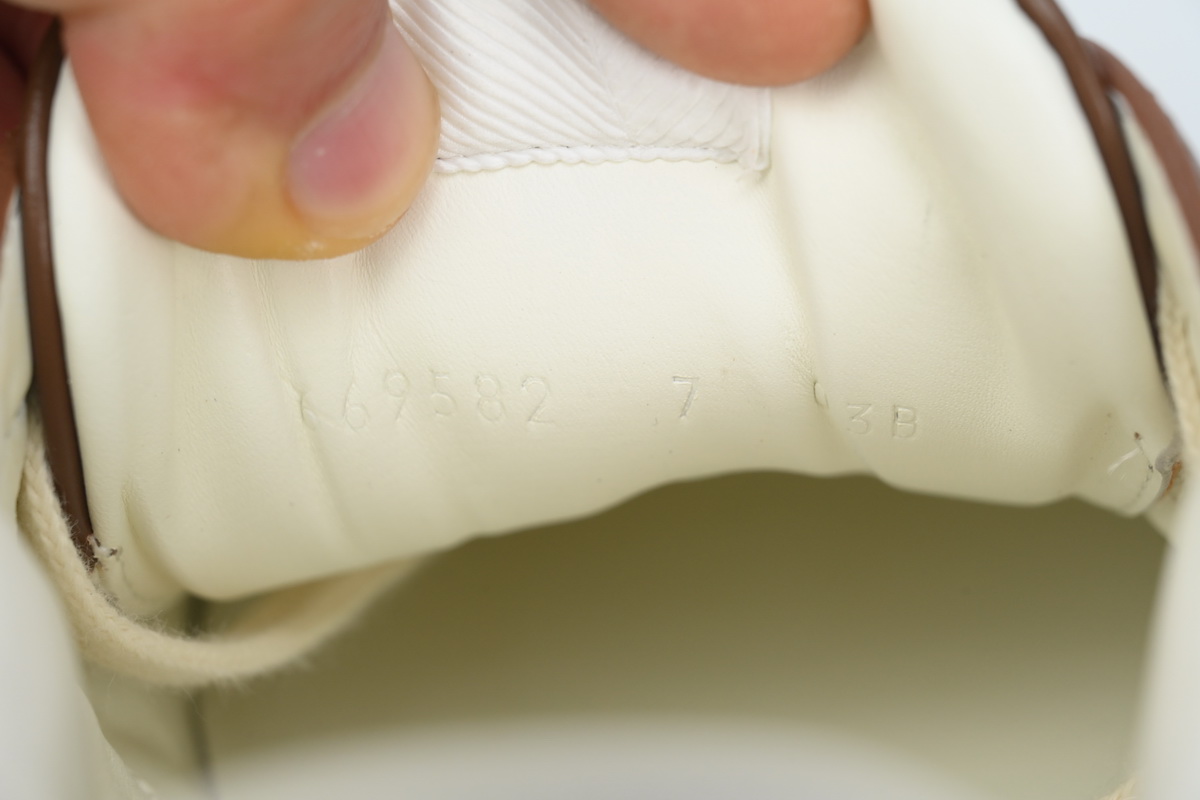 Gucci GG Embossed low-top Brown