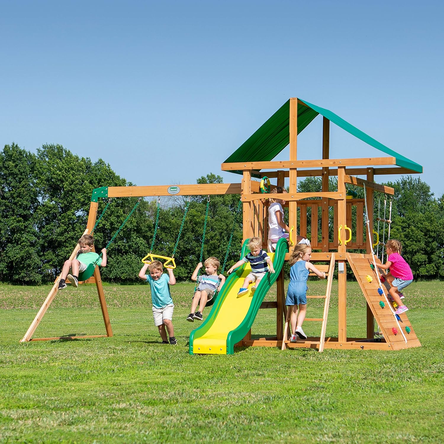 2026 SalesBackyard Discovery Mount Mckinley Cedar Wood Swing Set with Wave Slide, Play Deck, Double Rock Wall, Rope Ladder, Web Swing, Belt Swings, Toy Telescope, Steering Wheel, Sandbox Area, Outdoor Playset