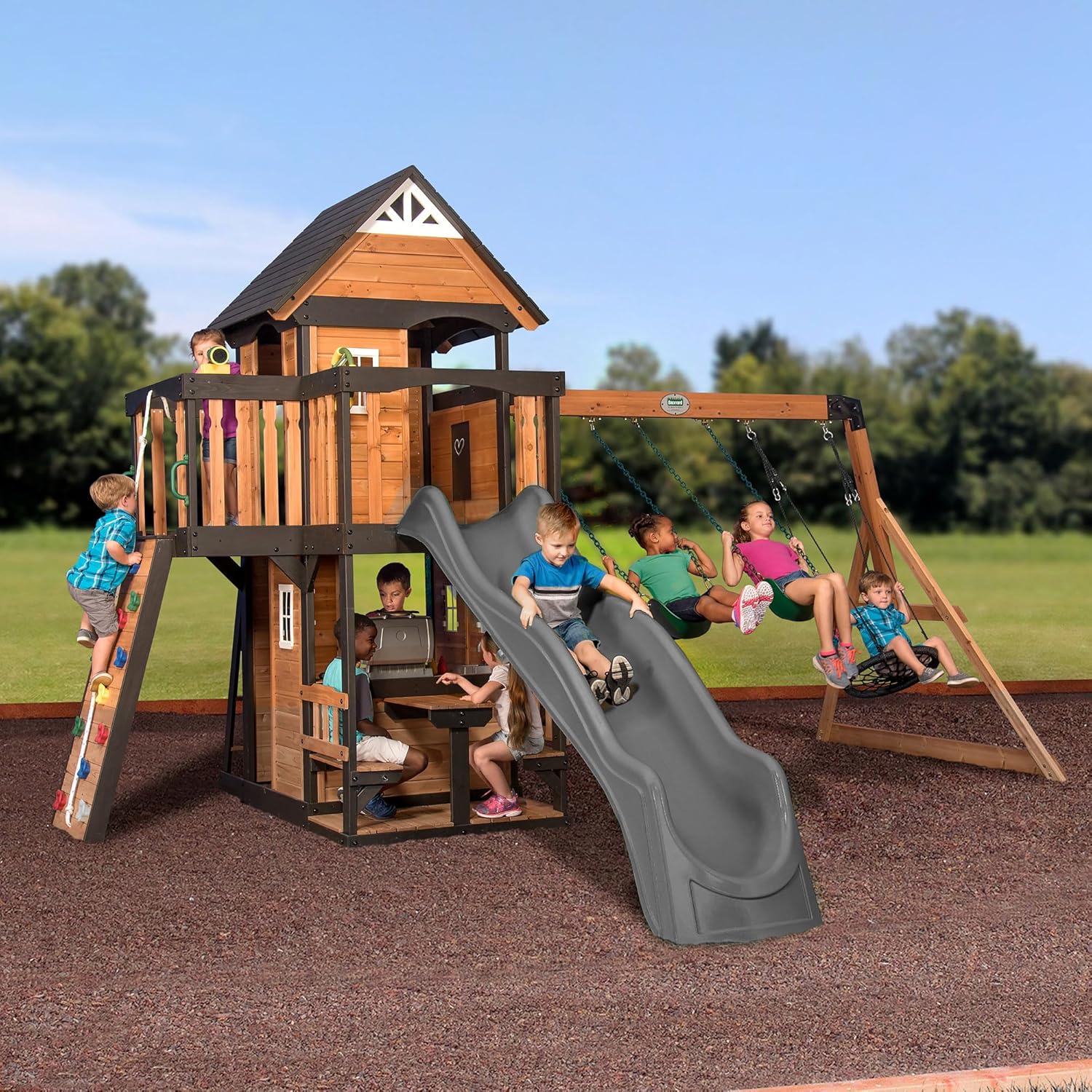 2026 SalesBackyard Discovery Canyon Creek Cedar Wood Swing Set with Wave Slide, Clubhouse, Play Kitchen, Picnic Area, Belt Swings, Web Swing, Rock Wall, Balconies, Playhouse, Step Ladder, Outdoor Playset